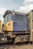 58002 at Toton depot Mainline Freight liveried 58002 pokes its nose out of the loco cleaning plant at Toton. 58002 at Toton depot Mainline Freight liveried 58002 pokes its nose out of the loco cleaning plant at Toton.