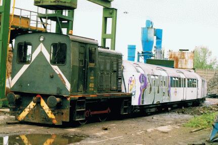 Army 410 WD shunter 410 at Snailwell shunting 1959 Northern Line tube stock for scrap Army 410 WD shunter 410 at Snailwell shunting 1959 Northern Line tube stock for scrap